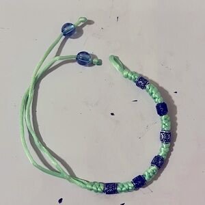 Green thread and beaded bracelet